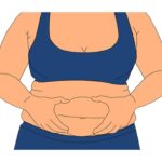 Woman squishing her fat belly
